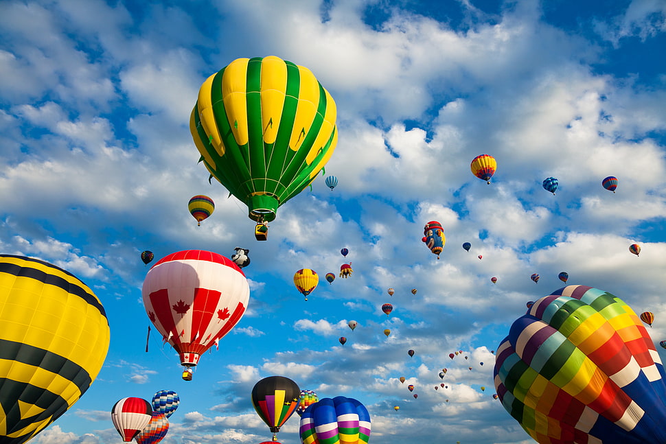 assorted hot air balloons under gray clouds during daytime HD wallpaper