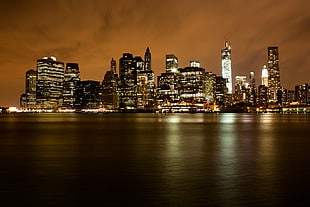 lighted cityscape during nighttime, manhatten