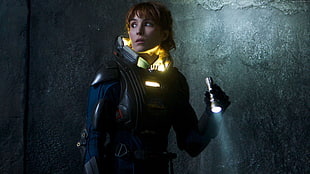 woman holding flashlight inside room