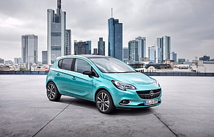 blue Opel 5-door hatchback HD wallpaper