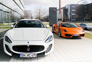 two white and orange sports cars HD wallpaper