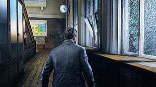 man wearing black jacket near window during day time HD wallpaper