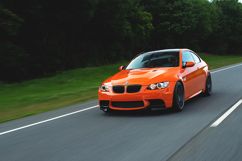 orange BMW coupe on road during daytime HD wallpaper