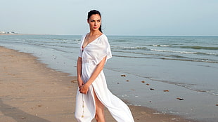 Gal Gadot standing on shore