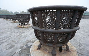 row and round black metal fire pits