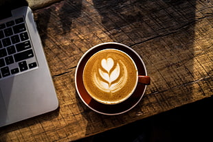 coffee on brown mug on table with red saucer HD wallpaper