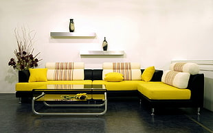 yellow and black living room sofa set with floating shelves