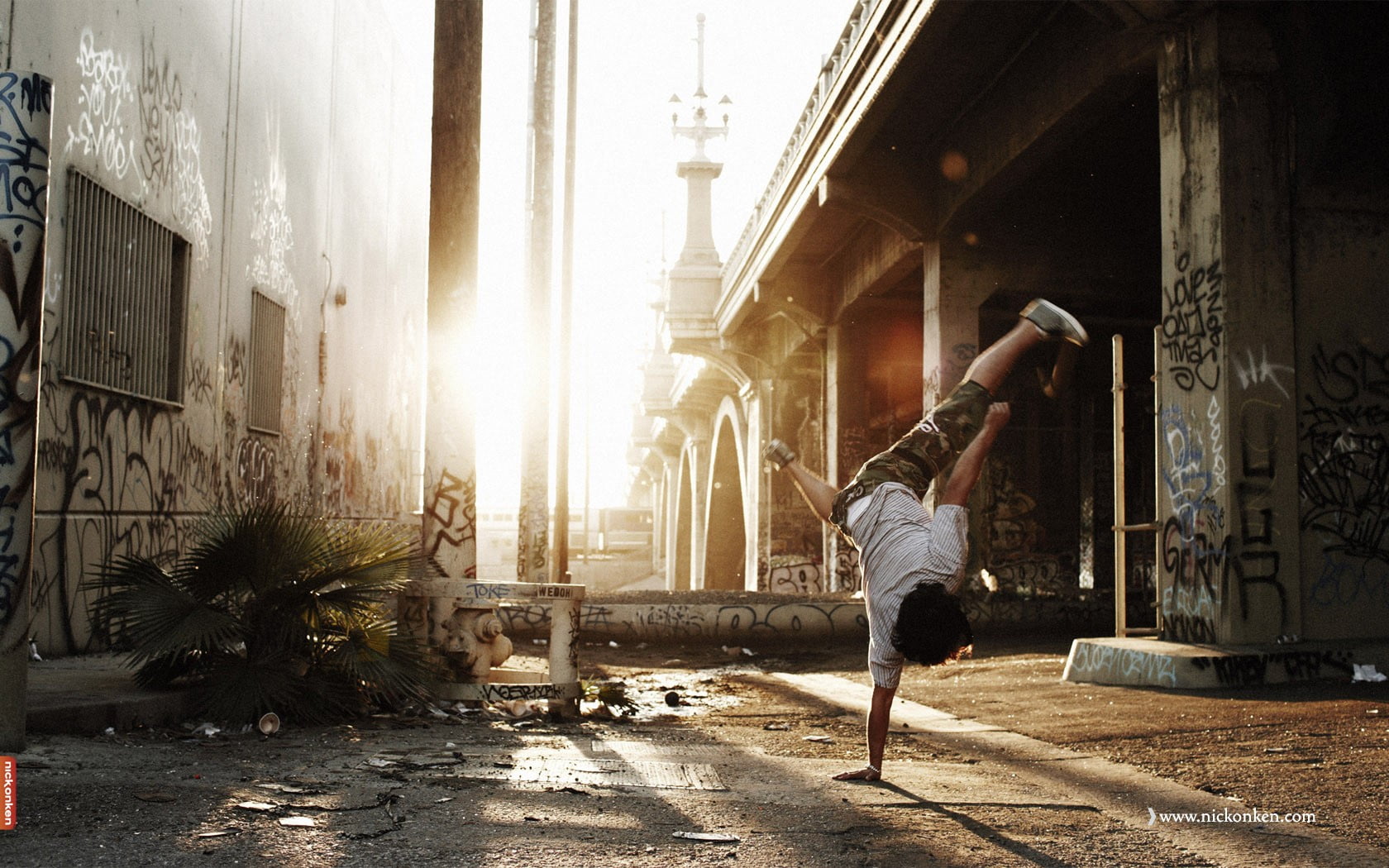 black and white metal frame, breakdance, urban, sunlight, bridge