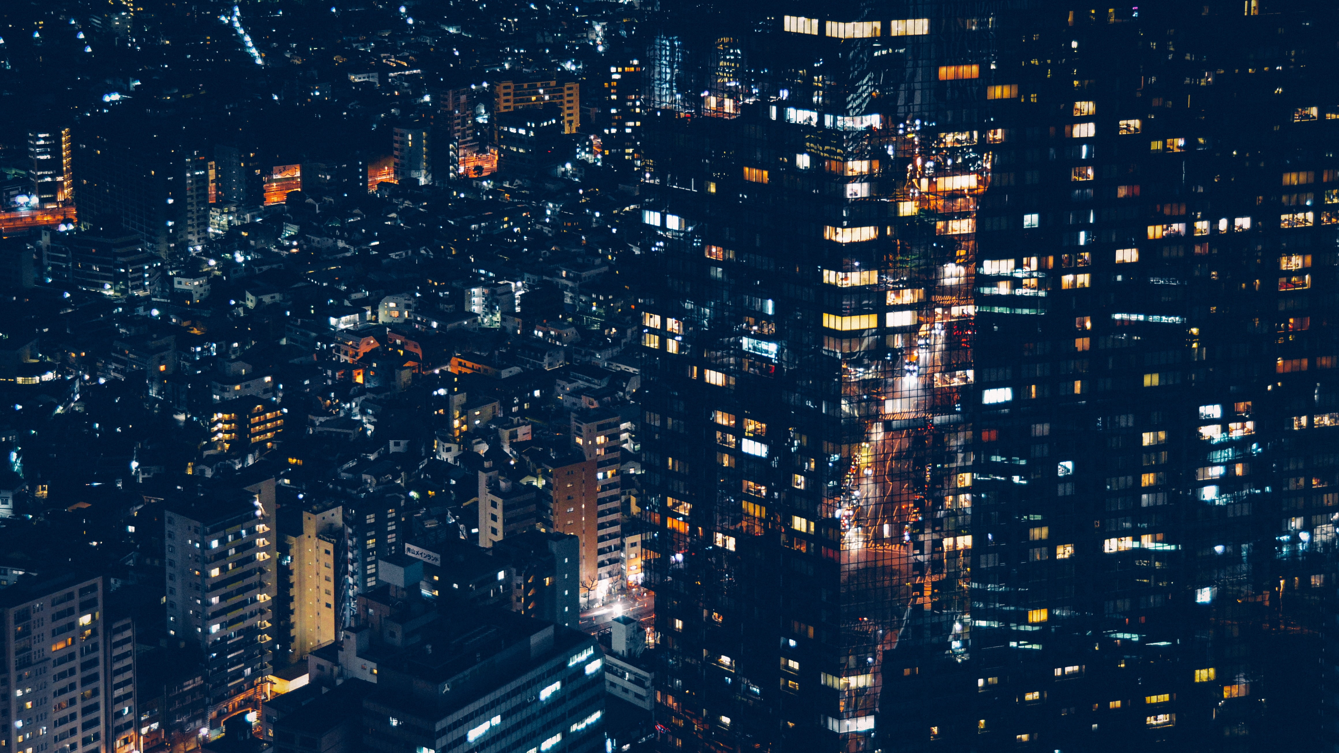 aerial photography of buildings with lights at night