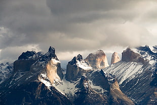 photo of mountains with snow during daytime