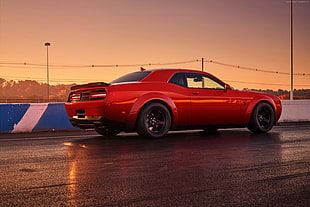 red coupe on road HD wallpaper