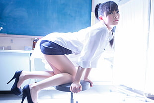 woman in white dress shirt and black miniskirt sitting on black bar stool HD wallpaper