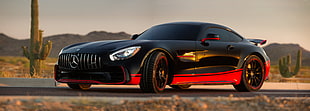 shallow focus photography of red and black Mercedes-Benz coupe