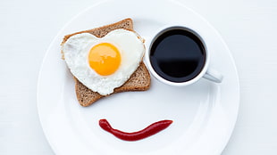 heart-shaped fried egg on wheat bread with coffee, eggs, toast, coffee, food