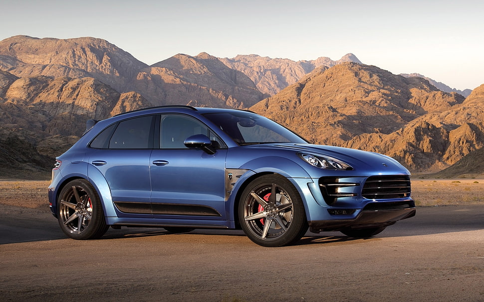 blue Porsche macan parked on asphalt road HD wallpaper