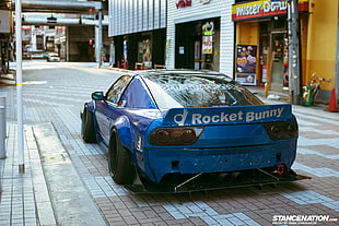 blue and black Rockey Bunny car on gray surface