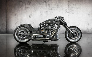 gray chopper motorcycle parked on floor tiles near the wall