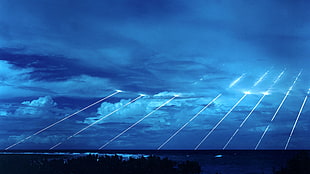 pine trees, clouds, sea, missiles, lights