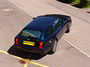 close up photo of black 5-door hatchback making a turn