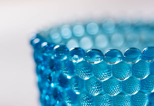 closeup photography of blue round cup