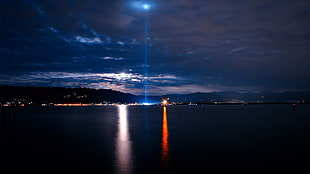 mountain and body of water, night, lights, sea, clouds