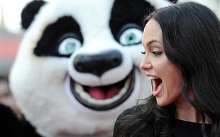 Angelina Jolie looking at Po mascot from Kung Fu Panda