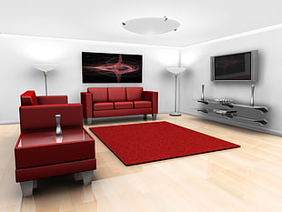 red leather sofa with sofa chair, table, area rug and flat screen TV