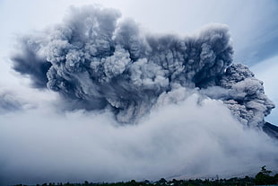 landscape photography of mountain emitting smoke