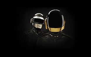 two men wearing black jacket and full-face helmets
