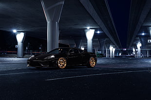 black coupe on road in landscape photography during night time HD wallpaper