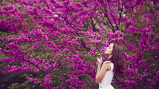 women's white sleeveless top, women outdoors, brunette, flowers, purple flowers