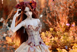 shallow focus photography of brown haired doll HD wallpaper