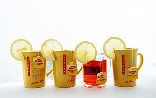 four Lipton tea packs on cup