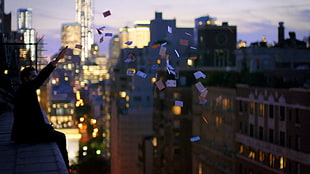 man throwing cards in the air, magic, David Blaine, cards, cityscape