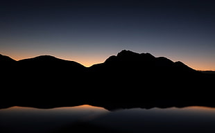 silhouette photo of mountain during golden hour HD wallpaper