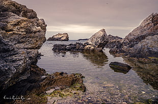 rock formation on the sea photography