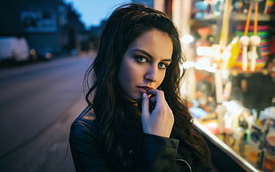 close up photo of woman wearing black leather jacket