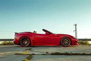red convertible coupe parked in road HD wallpaper