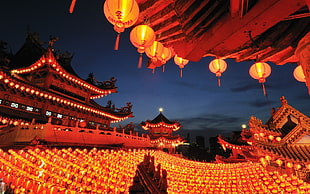 red paper lanterns lighting pagoda building during daytime HD wallpaper