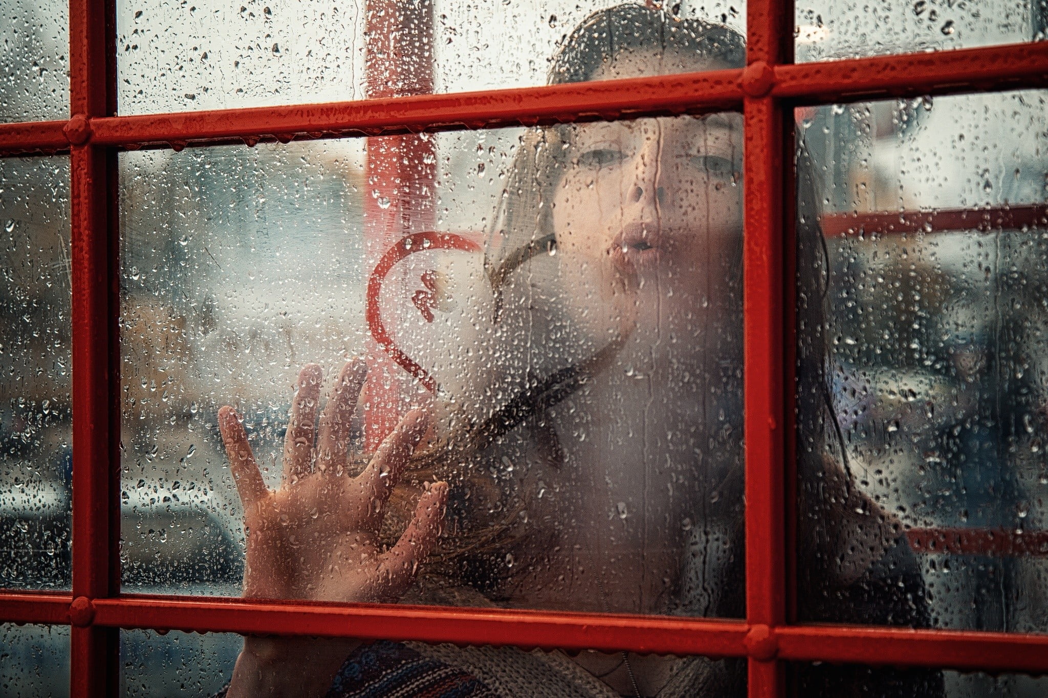 women blower on glass window with heart decor HD wallpaper.
