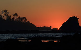 silhouette of mountain and beach