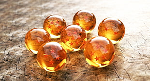 shallow focus photography of Dragon Ball Z glass Dragon Balls  set