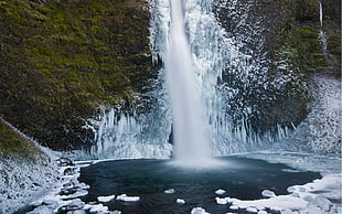 ice surrounding waterfall