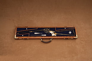 black antique revolver pistol with brown case HD wallpaper