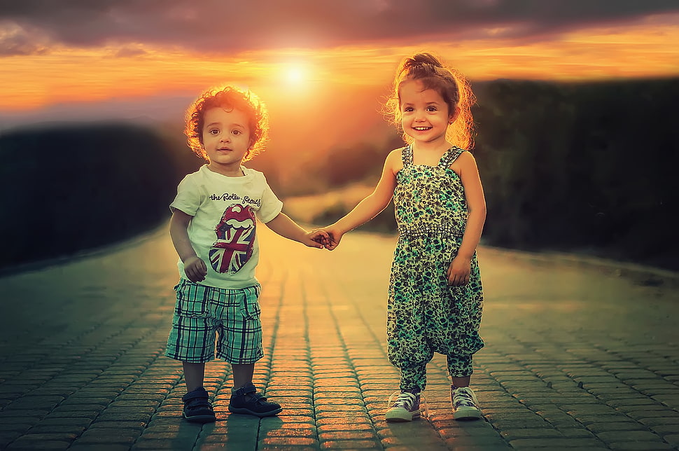 Boy and Girl standing behind the Sun HD wallpaper