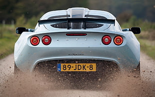 white Lotus sports car during daytime HD wallpaper