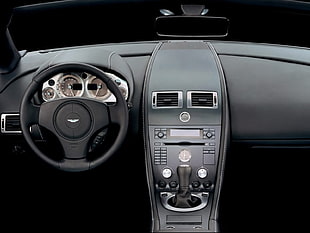 photo of black car steering wheel