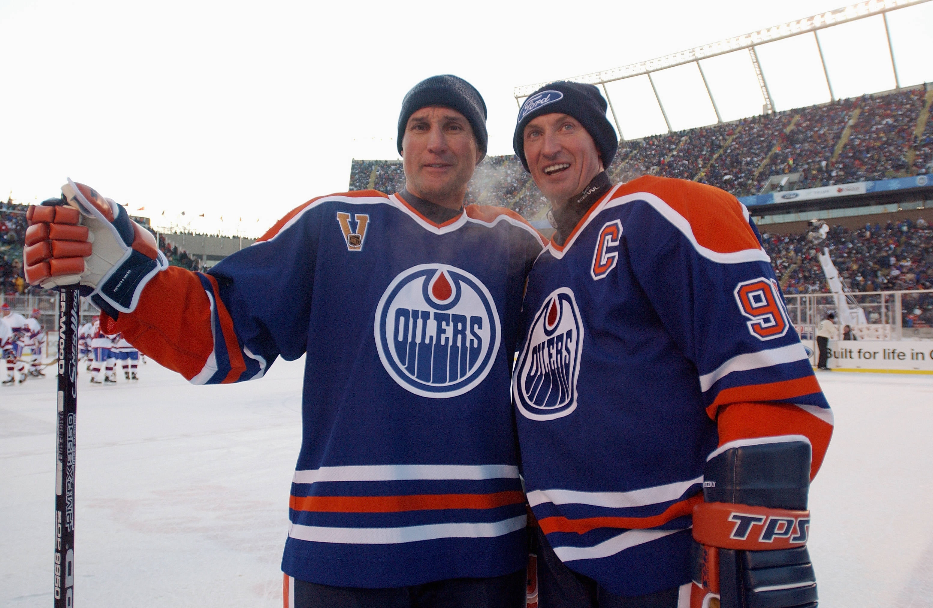 two Oilers hockey players standing on ice rink during daytime