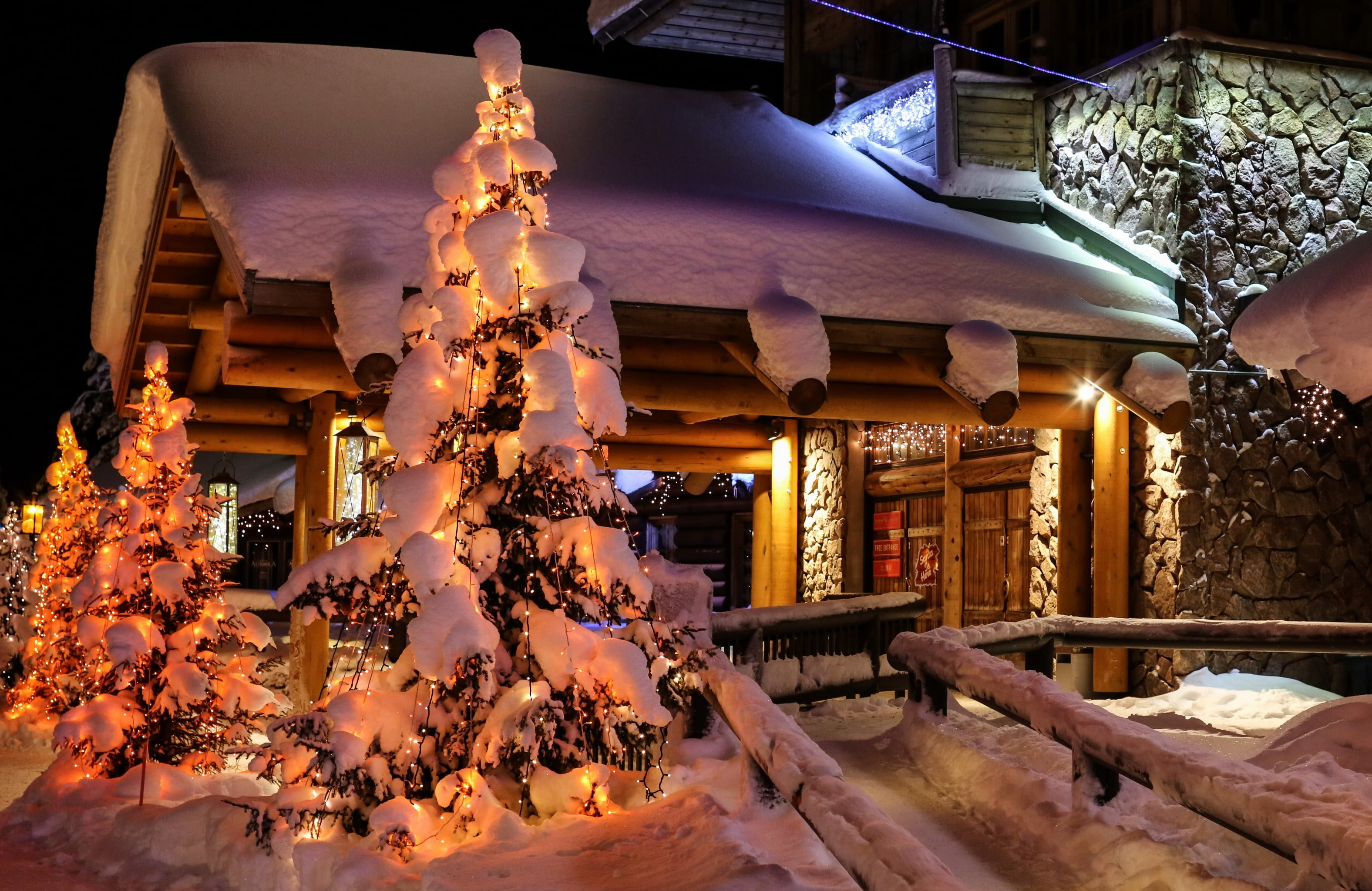 three green Christmas tree decors, snow