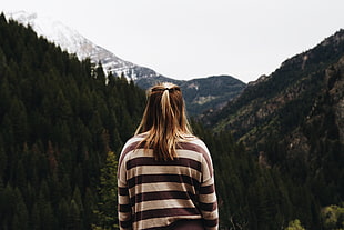 woman in striped shirt with mountains background